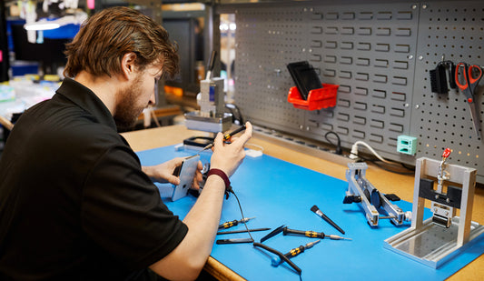 TekStore certified engineer repairing an iPhone